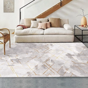 Detail of grey marble faux cashmere rug with golden geometric lines and soft texture