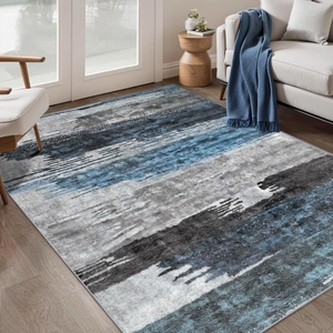 Detailed texture of blue and grey abstract gradient short pile faux cashmere rug
