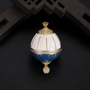 Elegant hot air balloon pendant in blue and cream enamel with sparkling zircon stones
