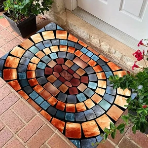 Detail of 3D mosaic stone pattern mat with terracotta and blue tiles on red brick floor