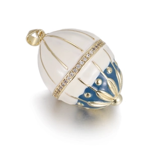 Macro view of vintage Fabergé style egg pendant with blue enamel and crystal details