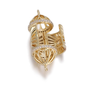 Detailed macro view of an openable golden birdcage pendant with white zircon stones