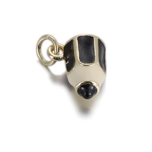 Macro detail of pencil-shaped copper pendant with gold finish and enamel drip oil crafts