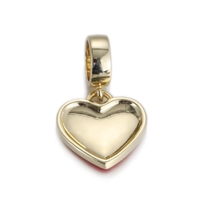 Close-up of heart-shaped gold pendant with polished mirror finish and wide top bail
