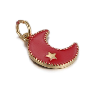 Detail view of a red enamel moon pendant with a gold star and metallic serrated border