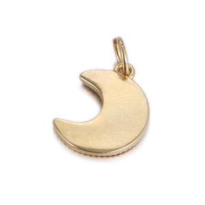 Close-up of golden moon-shaped metal pendant with hanging loop for DIY jewelry making