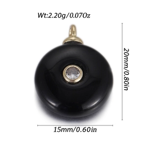 Detail view of a 15x20mm black natural stone pendant with gold loop and clear zircon inlay