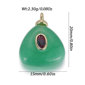Detail of triangle green stone pendant with red zircon inlay and gold metal framing