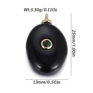 Detailed view of oval black stone pendant with green gem inlay and precise measurements