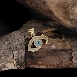 Detailed view of evil eye heart pendant with blue stones and clear zircon inlay