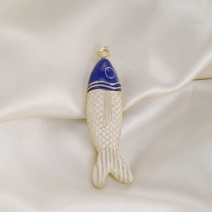 Colorful tropical fish pendant with blue enamel and gold scales on white silk background