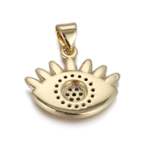 Detailed macro view of golden evil eye pendant with eyelashes and mother of pearl