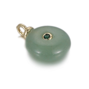 Macro detail of natural green stone pendant with gold clasp and central green zircon inlay