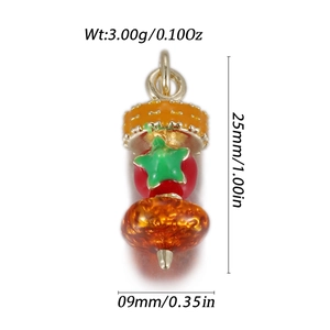 Detail shot of mini cartoon fruit pendant with orange enamel and gold jump ring