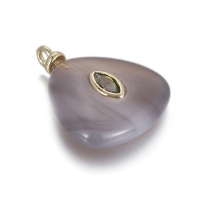 Detail of triangular chalcedony pendant with marquise green stone in gold setting
