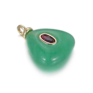 Detailed view of green natural stone pendant with red zircon inlay and gold plating