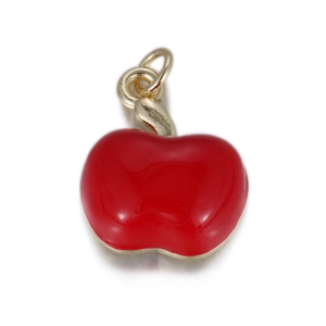 Macro detail of red enamel apple charm with gold hanging ring for DIY jewelry making