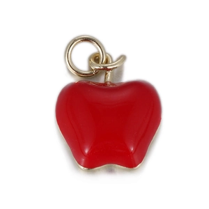 Detail of red enamel apple pendant with golden metal loop for necklace making