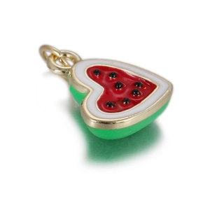 Macro detail of heart-shaped watermelon pendant with colorful enamel and gold metal rim