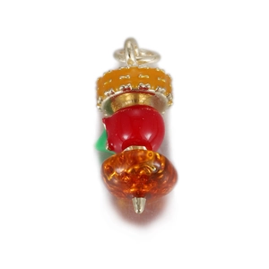 Detailed view of layered 3D fruit pendant with enamel disk and translucent amber beads