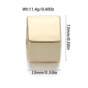 Macro shot of 13mm gold cubic bead with dimensions and weight of 11.4g shown
