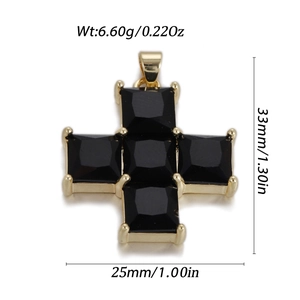Macro shot of gold cross pendant with black square gemstones and precise dimensions