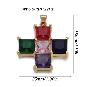 Macro shot of colorful gemstone gold cross pendant with dimensions 33mm and 25mm
