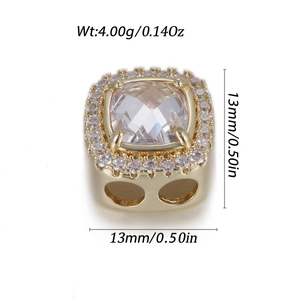 Macro detail of a 13mm gold square cushion-cut pendant with halo design and side holes