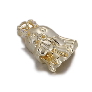 Detailed view of a gold ghost pendant with bow and micro-inlaid crystals for DIY jewelry