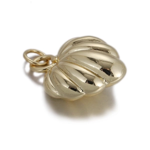 Detailed macro view of scallop shell pendant in light gold finish for DIY jewelry