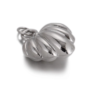 Detailed view of silver shell-textured heart pendant with polished 3D metal ridges
