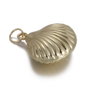 Detailed close-up of a golden seashell pendant with natural ribbed texture for DIY jewelry