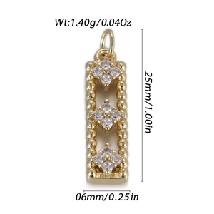 Detailed view of rectangle gold pendant with zircon flowers including size 25x6mm and weight