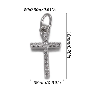 Macro shot of a silver cross pendant with pavé cubic zirconia and size dimensions