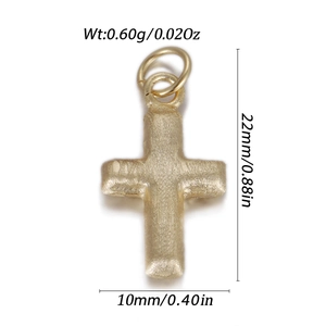 Detail showing cross pendant dimensions 22mm by 10mm in a matte gold finish