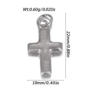 Macro view of silver cross pendant showing dimensions 22x10mm and 0.60g weight details