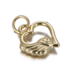 Detailed view of a golden heart pendant with wing design and polished metal finish