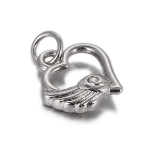 Detailed view of silver heart pendant with embossed wing texture and hanging ring
