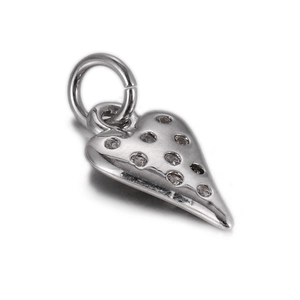 Close-up of heart-shaped pendant in silver finish with pavé set sparkling zircon stones