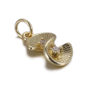 Macro shot of double scallop pendants in gold finish with sparkling cubic zirconia stones