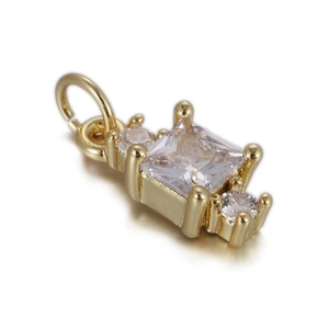 Detailed close-up of a square zircon pendant with gold-plated base and small round stones