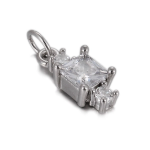 Close-up of silver-tone pendant featuring square princess-cut clear zircon stone