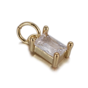 Macro shot of rectangular zircon stone pendant with gold-plated four-claw setting