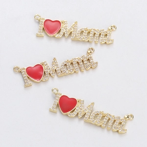Detailed view of 'I ❤️ Mama' pendant connector with gold plating and cubic zirconia inlay