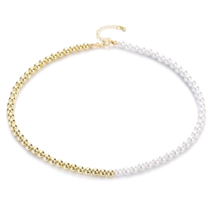 Detail of French vintage necklace with gold metal beads and white pearls stitching