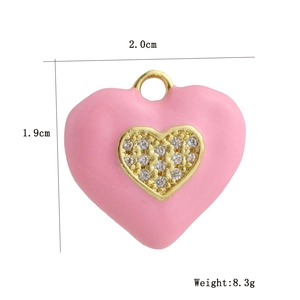 Detail of pink enamel heart pendant with micro-pave cubic zirconia and gold finish