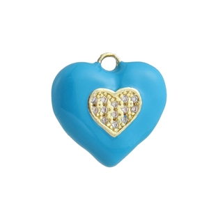 Macro shot of light blue enamel heart pendant with pavé set white cubic zirconia stones
