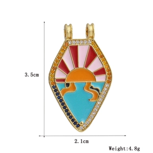 Detailed view of sun and sea enamel pendant with dimensions 3.5cm by 2.1cm and 4.8g weight