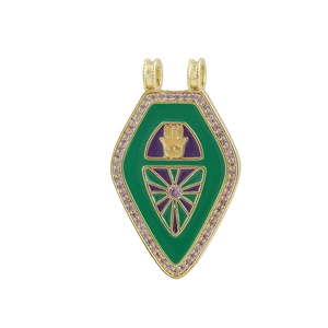 Detailed view of gold shield pendant with Hamsa symbol, colorful enamel, and pink crystals