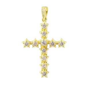 Macro shot of gold cross pendant with star-shaped settings and cubic zirconia stones